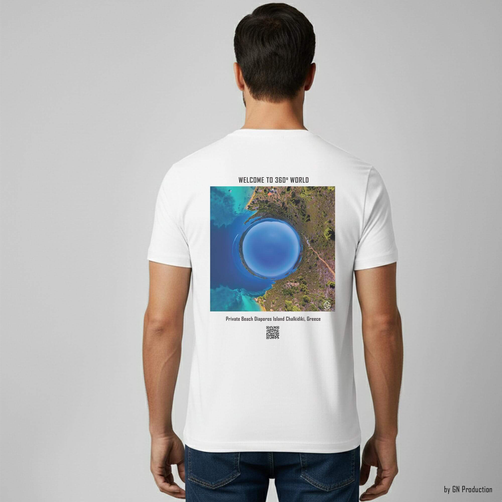 Man model wearing white art T-shirt with inverted tiny-planet 360° print of Private Beach, Diaporos Island, turquoise sea and coastal landscape.