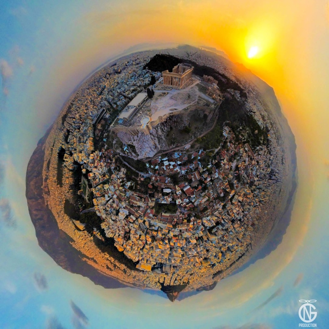 Anniversary sunset tiny-planet 360° of the Acropolis of Athens—urban amber ring, city lights, Aegean-blue sky.