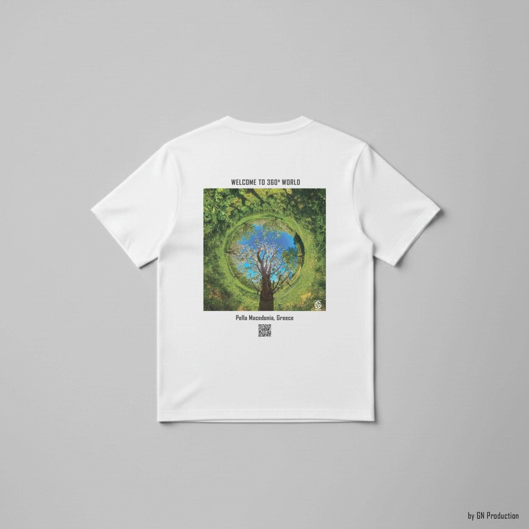 White art T-shirt featuring Pella cherry orchard inverted tiny-planet 360° artwork, fresh spring greens and blossom textures, designed and handmade in Greece.
