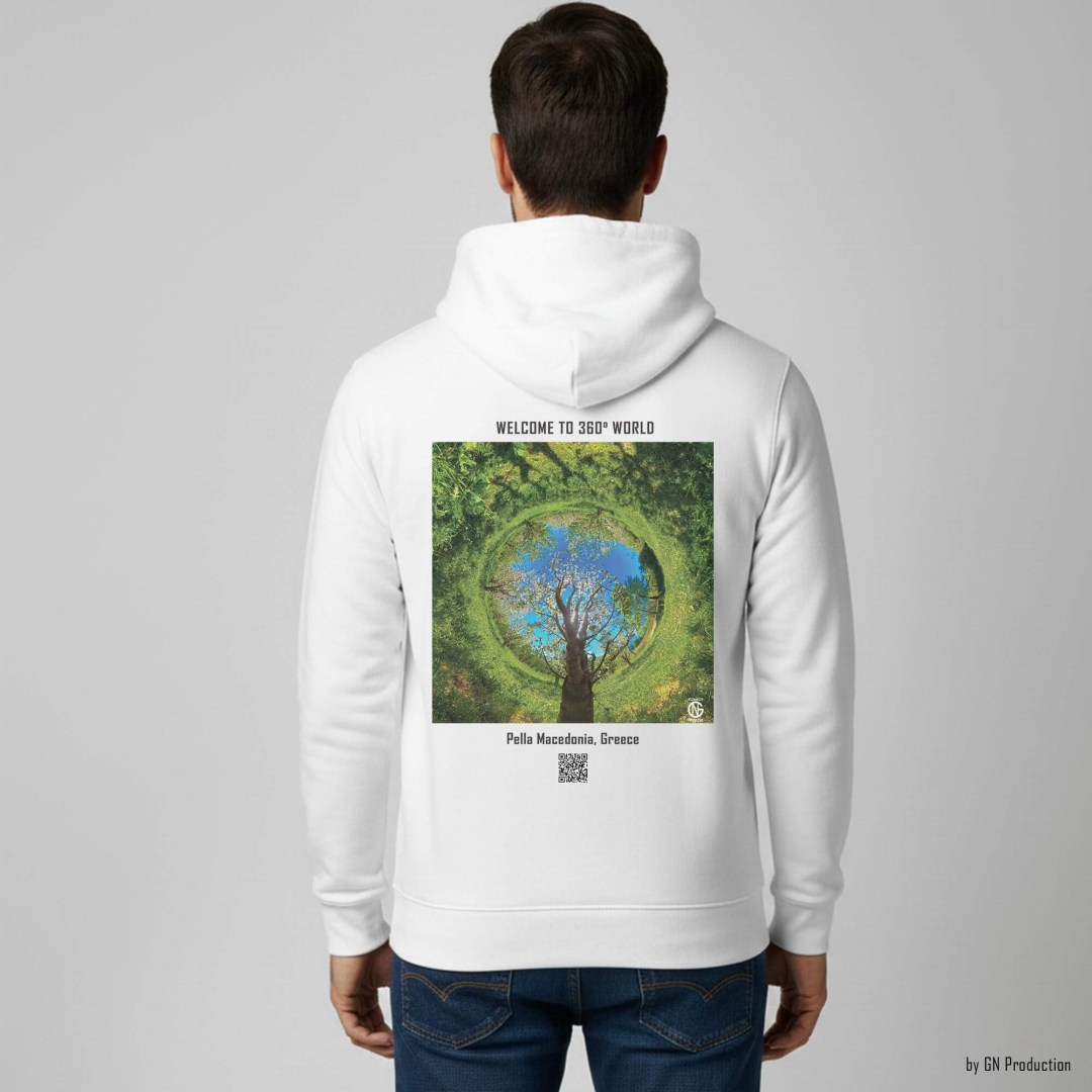Man wearing white GN Production hoodie, back view, Pella Macedonia inverted tiny-planet 360° cherry orchard artwork with central tree and balanced floral composition.