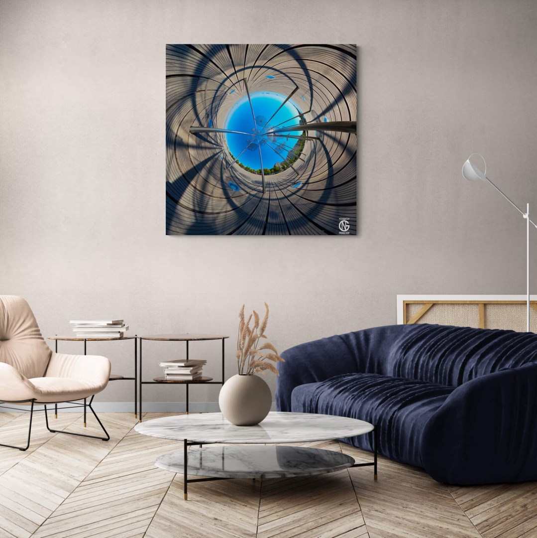 Inverted tiny-planet Umbrellas canvas adding abstract energy to a modern living room with navy sofa.